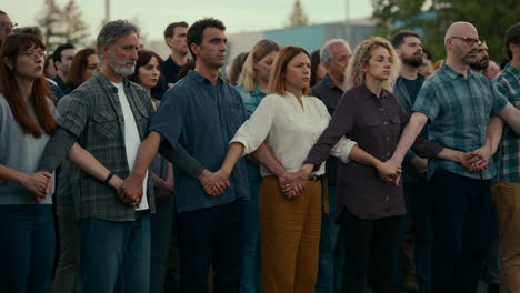 diverse group of people holding hands in solidarity