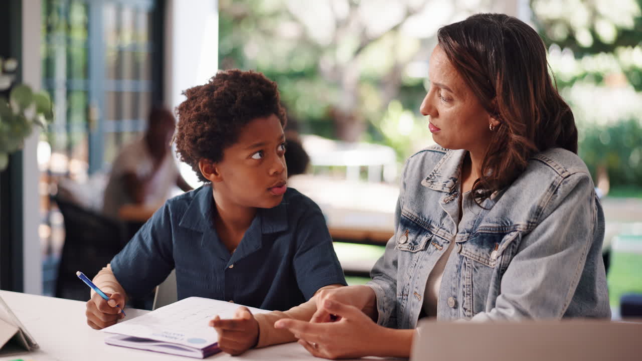 Mother helping her son with homework