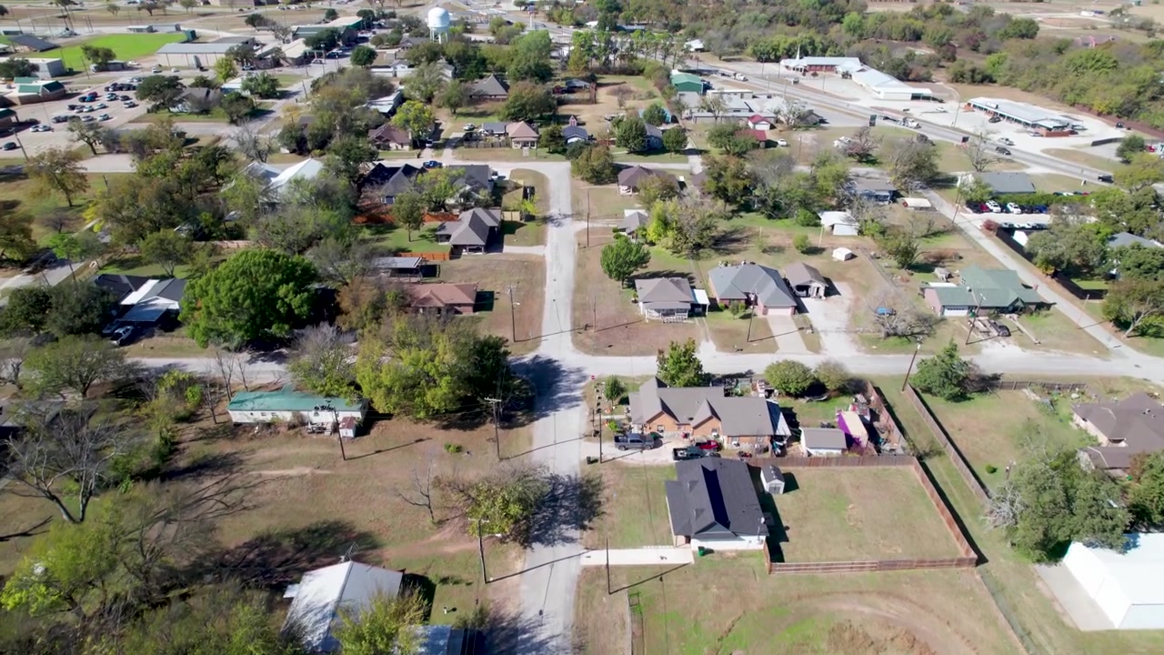 Aerial flight over houses in Boyd, Texas flying west over W Morton Ave.