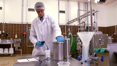 Brewery-worker-checking-the-product