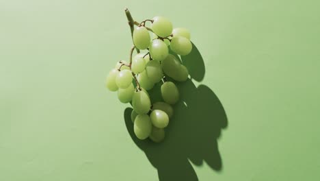 Video-of-white-grapes-with-copy-space-over-green-background