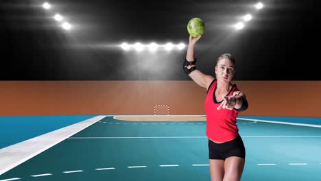 Animation-of-caucasian-female-handball-player-holding-ball-over-sports-stadium