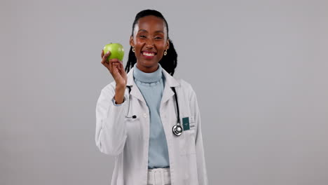 Black-woman,-doctor-with-apple-and-face