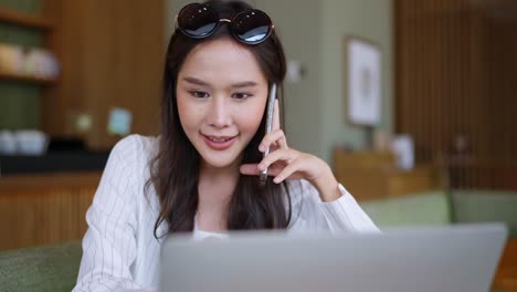 smart attractive asian female business woman casual cloth freelance work leisure relax working with tablet and smartphone at cafe restaurant urban lifestyle digital nomad working in co working space