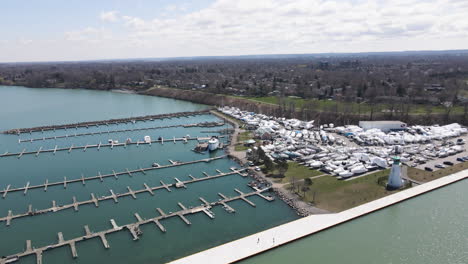 boats storage area, outside nautical parking dock for sailing yachts and leisure boats at port dalhousie pier ontario canada, off season harbor marina coastal waterfront landscape, aerial view