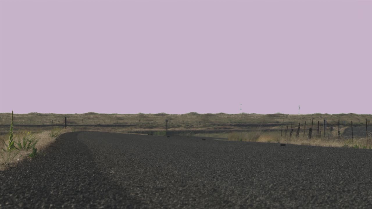 dry desert rocky grassland landscape. low shot of road