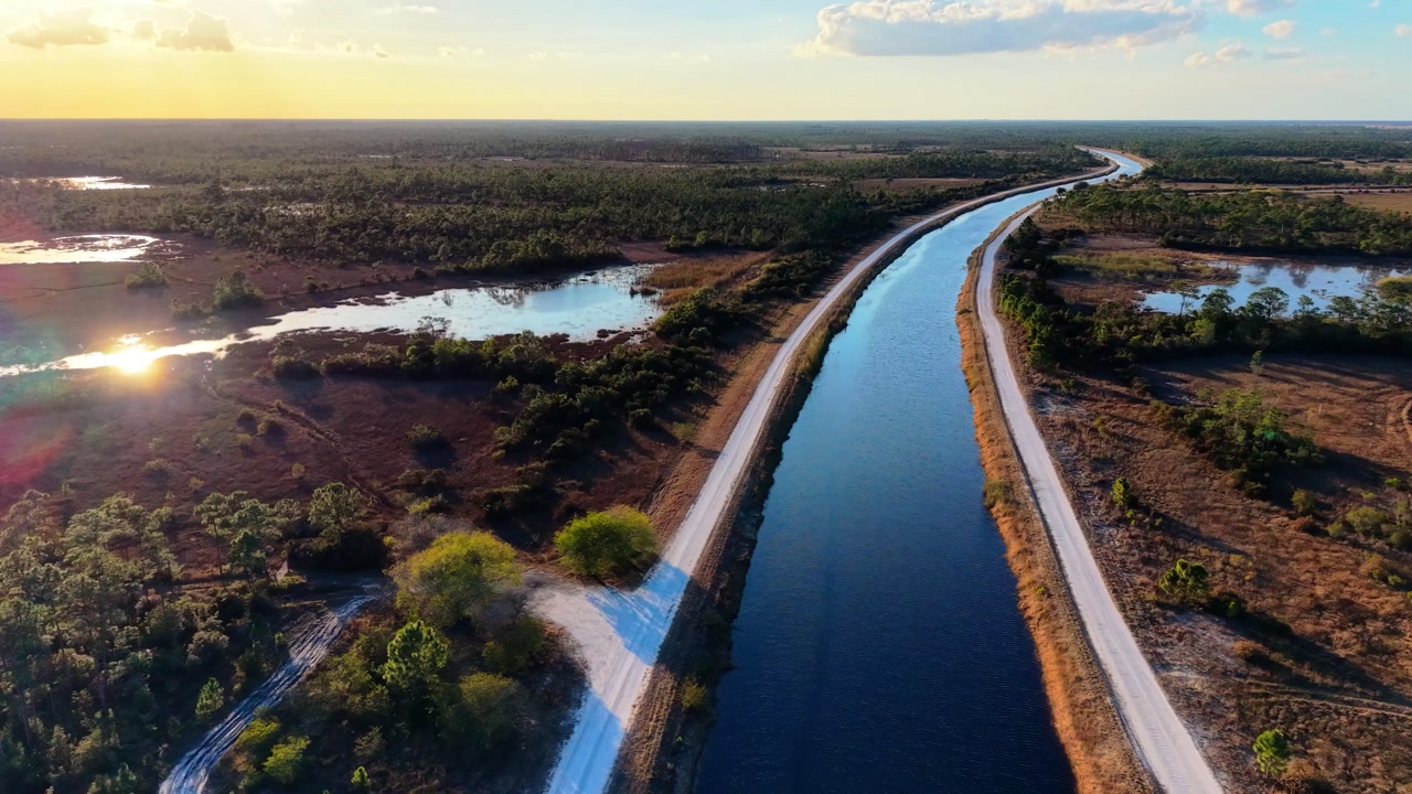 Drone flying over on of the canals in the John C. and Mariana Jones Hungryland Wildlife and Environmental Area showing the vast expanse of the area in Martin and Palm Beach County Florida