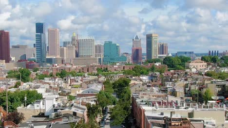 baltimore skyline and inner harbor revealing street and houses in residential area