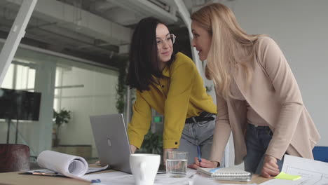 females in a business meeting. teamwork discussing a new exciting project in the office. international women's day.