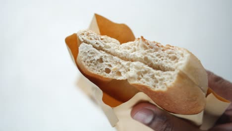 fresh bagel bread in a paper on table