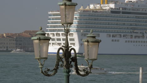 cruise ship sailing through venice italy view with vintage lantern