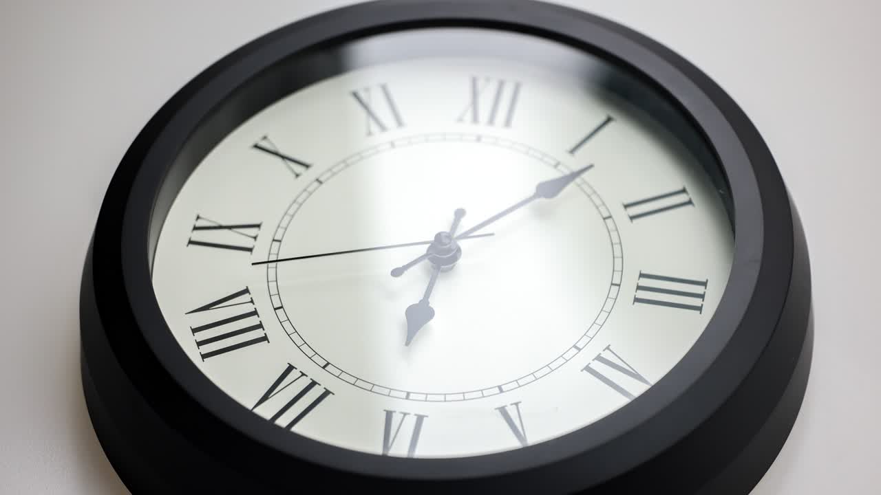 time lapse of a  old-fashioned antiquated wall clock with roman numerals