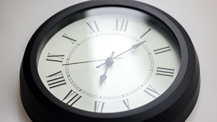 time lapse of a old-fashioned antiquated wall clock with roman numerals