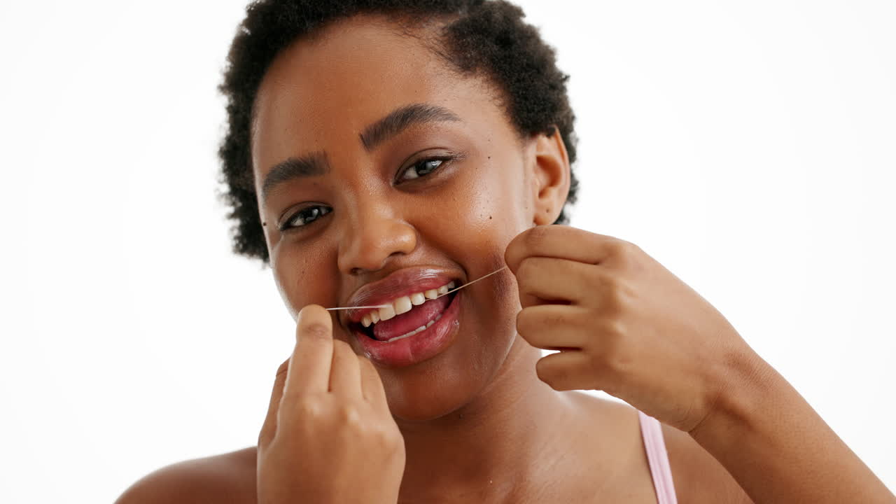 Woman Flossing Her Teeth