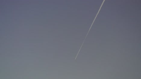 jet making a contrail in the blue sky