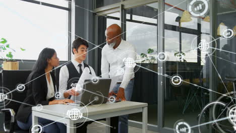 animation of network of connections with icons over diverse business people in office