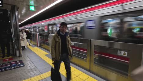 passengers boarding and alighting a subway train