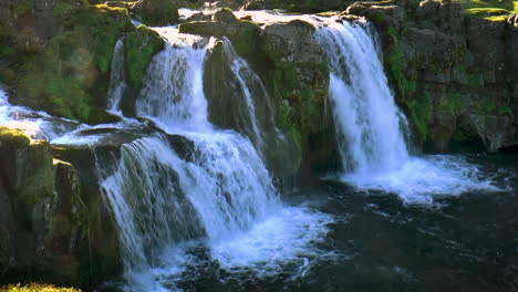 Slow-motion-footage-of-Kirkjufellsfoss-near-Kirkjufell-mountain-on-Snaefellsnes-peninsula,-Iceland