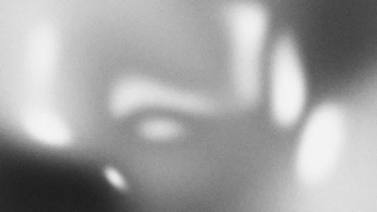 Abstract Moving Light and Shadow Shapes with Grainy Texture