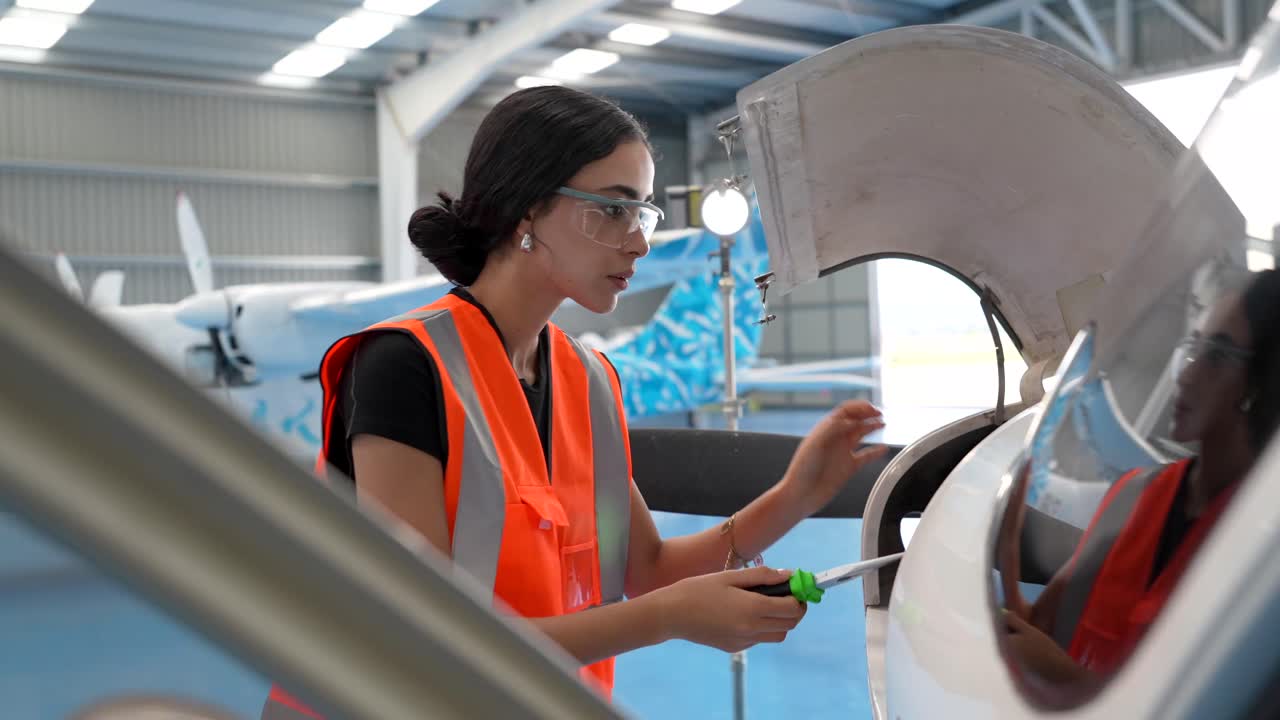 Aircraft Maintenance by Female Engineer in Hangar