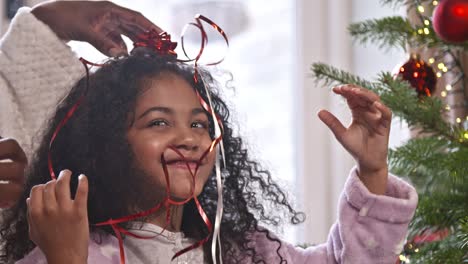 mother and child playing with ribbons