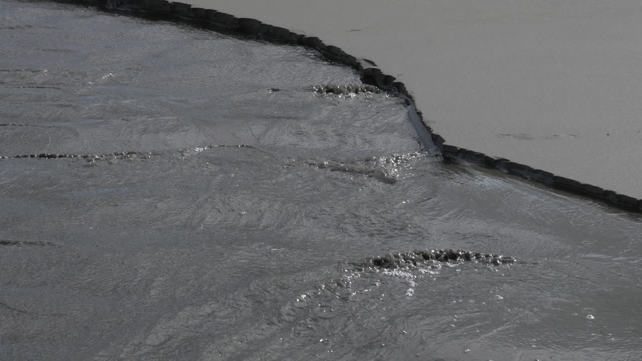 Ocean level rising flux eating sand beach shore coastline in South America