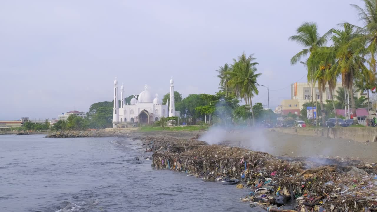The city of Padang in Sumatra using the beach as a landfill and burning the waste