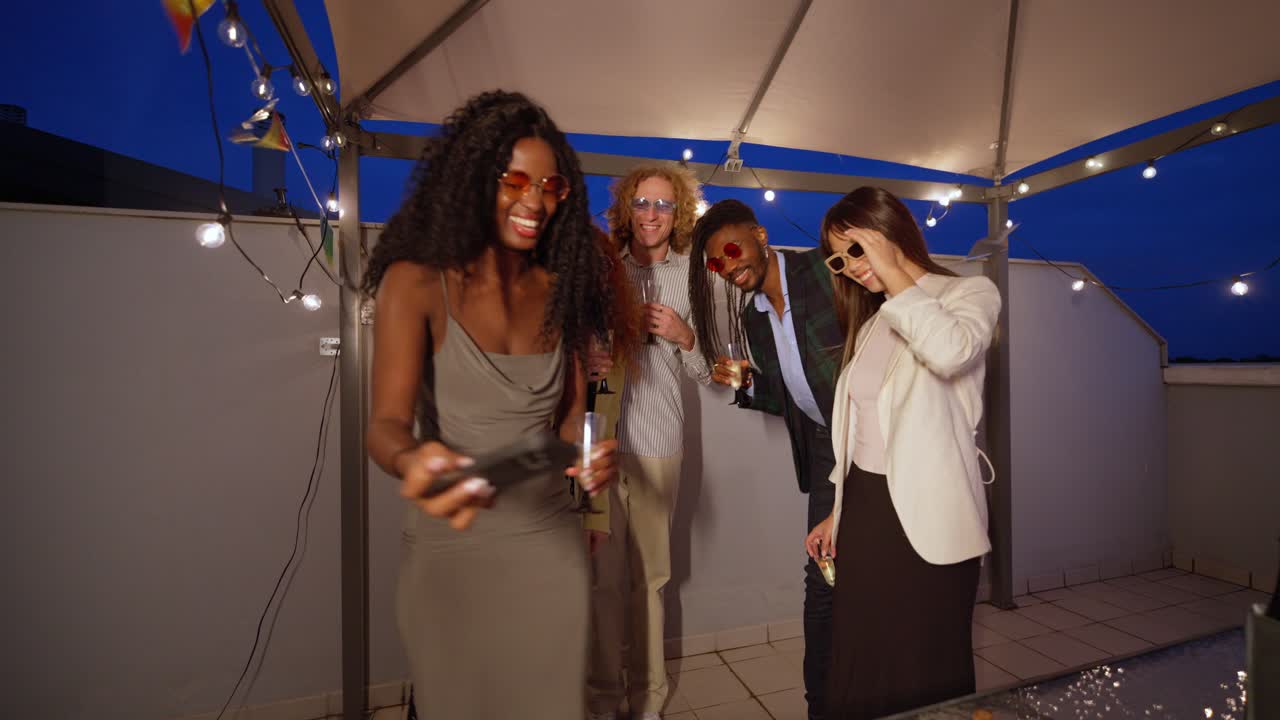 Group of friends celebrating at a rooftop party