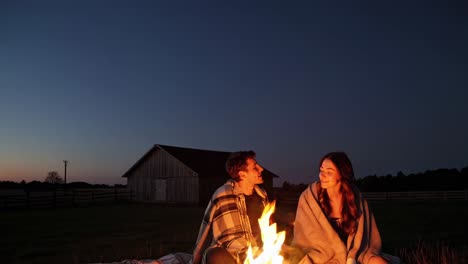 Couple by Campfire at Dusk