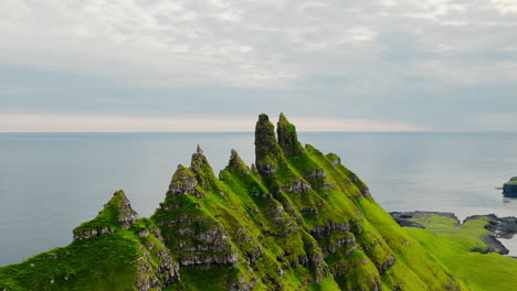 dramatic green sea cliffs and sea stacks along the coast of the faroe islands