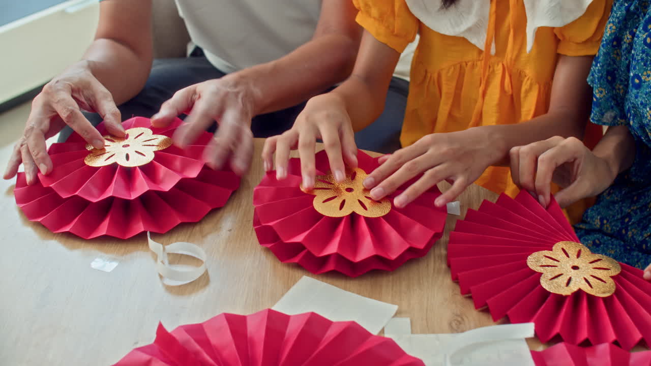 Kid and Parents Crafting Spring Festival Decorations