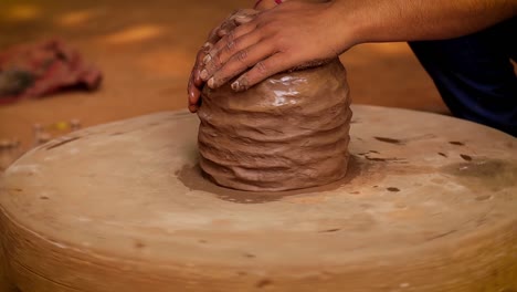 potter at work makes ceramic dishes. india, rajasthan.