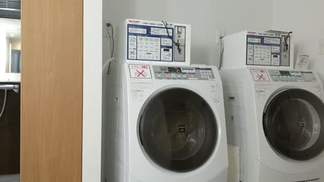 A-commercial-coin-operated-Japanese-combo-washing-machine-dryer-combo-doing-exactly-what-it's-made-to-do