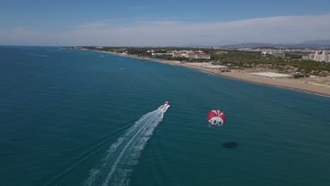 parasailing on beach with boat