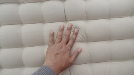 person examining an inflatable mattress