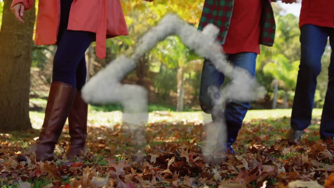 animación de la casa formada con nubes sobre la familia con el hijo en el parque de otoño