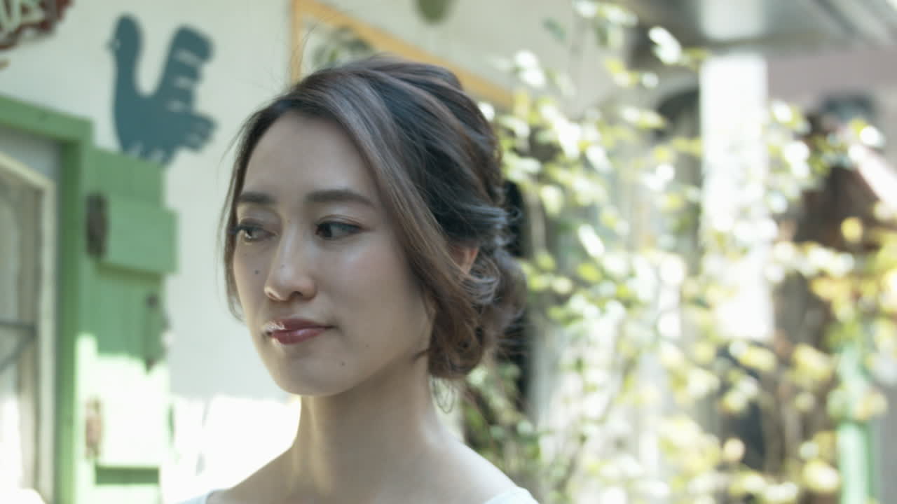 Beautiful hair model posing for photos outside salon