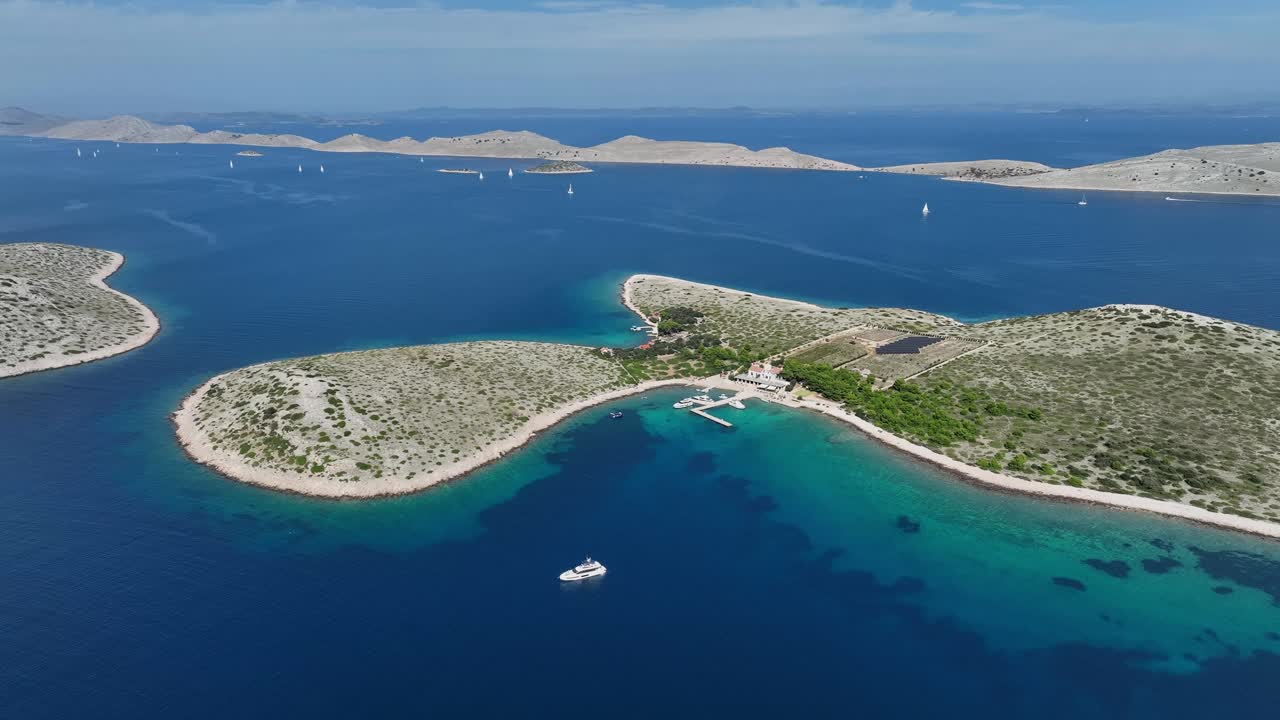 Turquoise Sea Surrounding Islands In Kornati Archipelago Of Croatia. aerial pullback shot