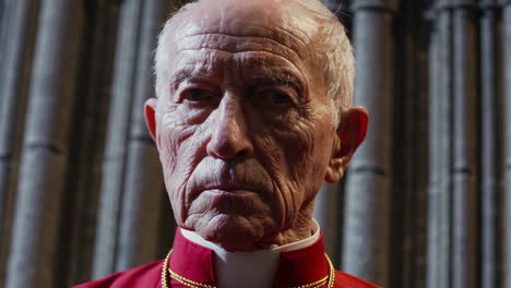 portrait of an elderly clergyman in a cathedral