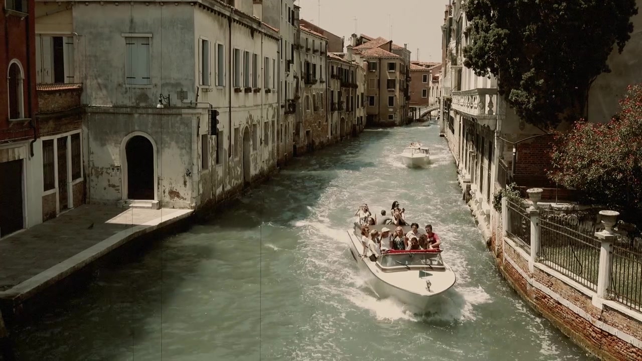 Summer view of Venice narrow canal and historic palaces from Foscari Bridge