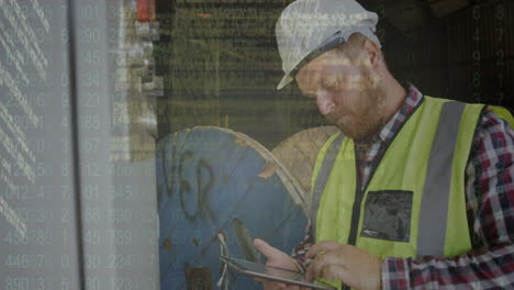 screen with data processing against caucasian male construction worker checking meter readings