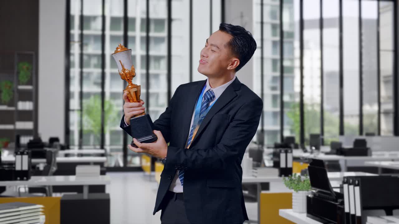 Businessman Celebrating an Award in Office