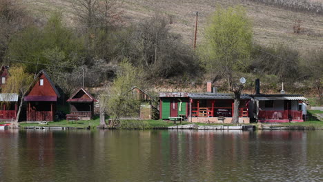 fishing huts on the lake shore