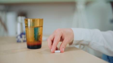 sick girl takes pill for cure