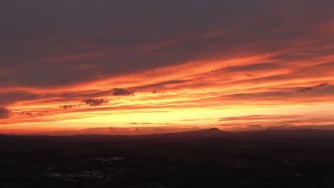 aerial view of silhouette landscape at sunset