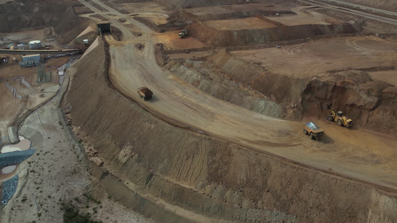 Trucks at work in open nickel mine, Western Australia