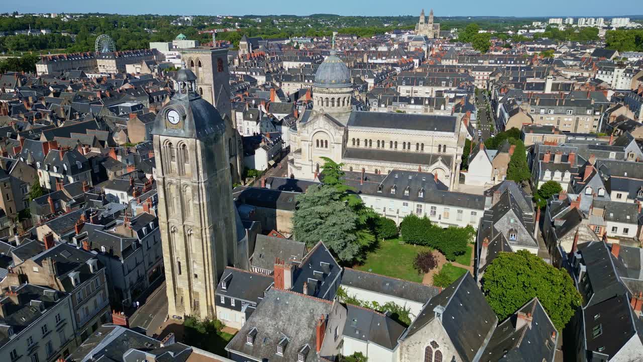 Basilica of Saint-Martin and clock tower in Tours, France. Aerial drone orbiting and cityscape