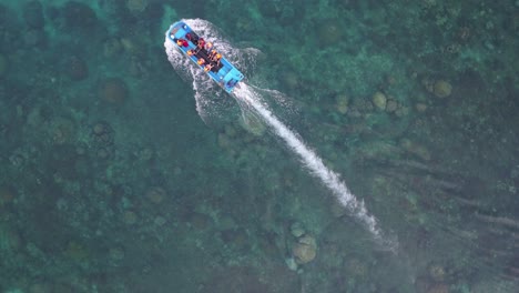 aerial view of a boat with people in the ocean