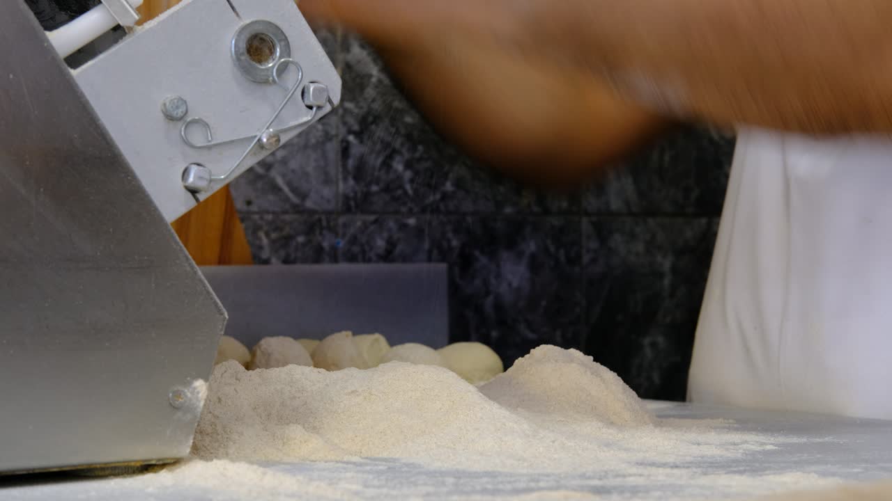 Hands making phyllo bread dough