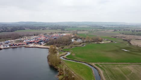 High-Aerial-drone-view-of-a-pond-with-housing-estate